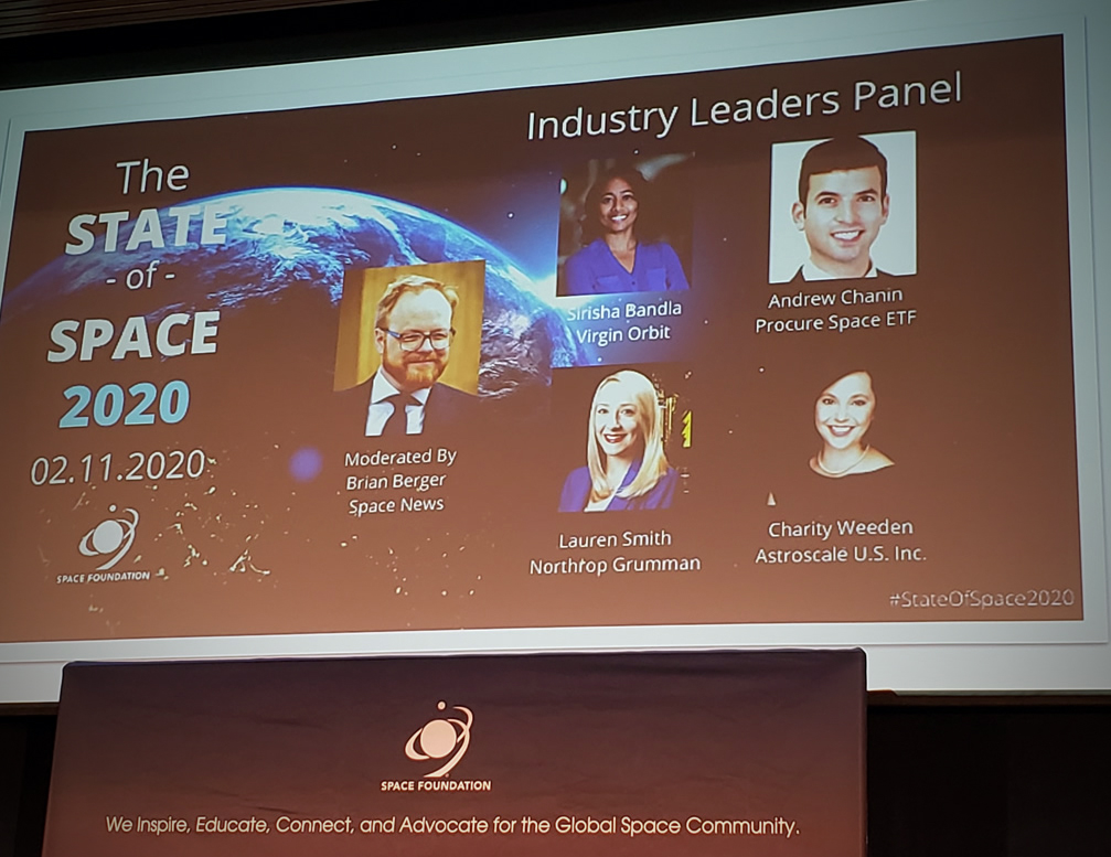 A projected screen highlighting members of the industry panel