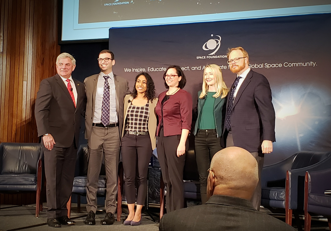 A group photo of the industry panel members with the Space Foundation CEO